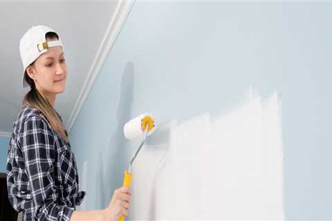 How do you prepare a previously painted wall for painting?